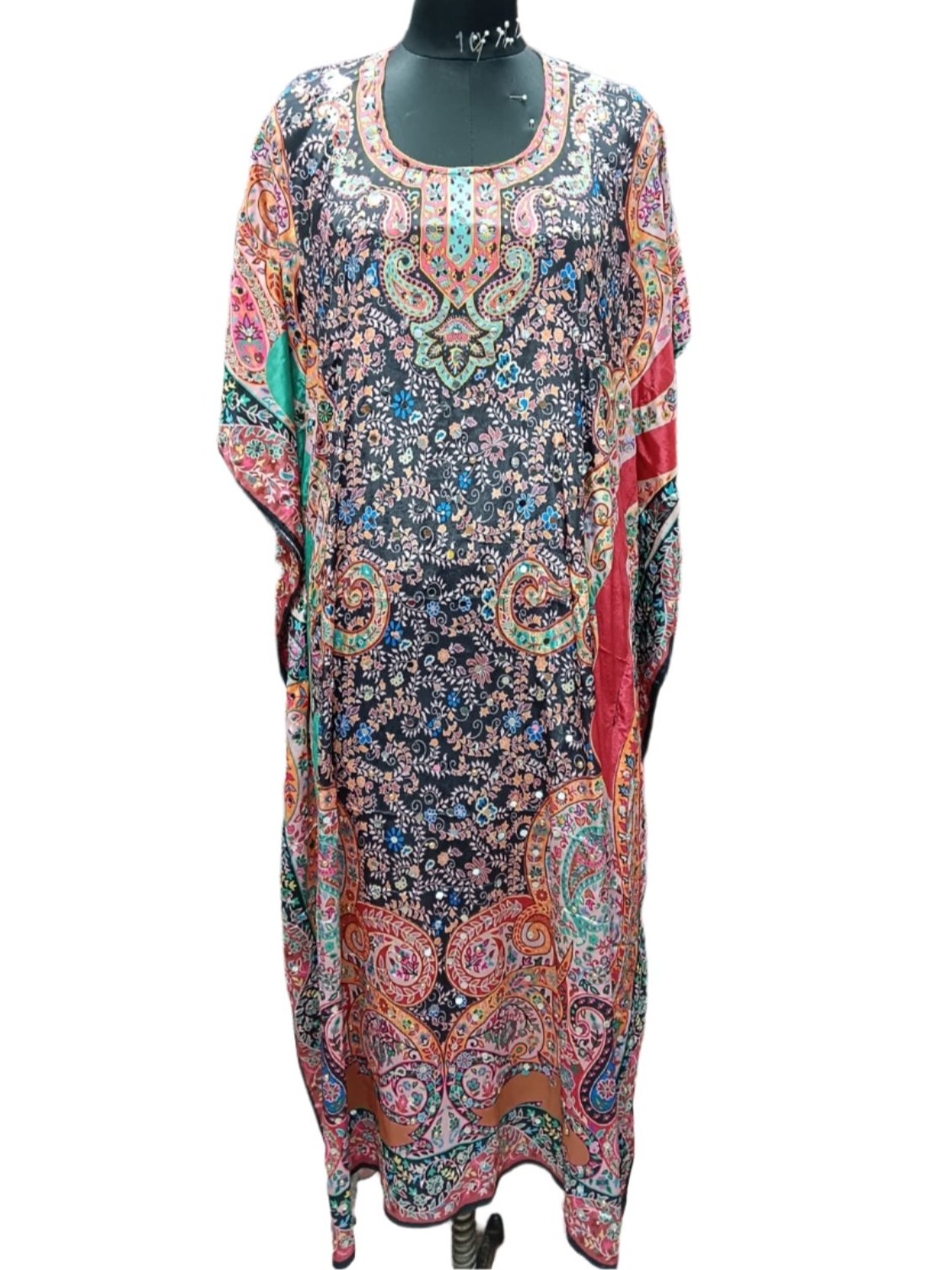 Embrace the timeless beauty and effortlessly stylish design of this kaftan